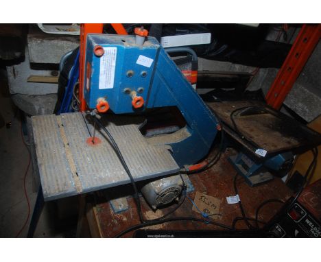 A 'Draper' bench table-saw , plus a 'Black & Decker' bandsaw.