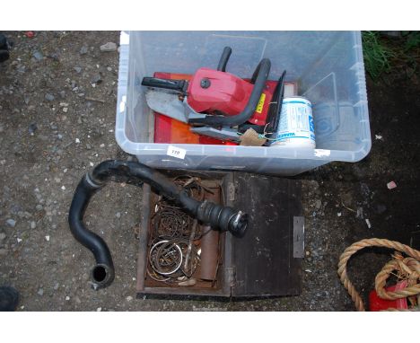 A box of Piston rings, a tub of Commercial rear-tail lamps, Chainsaw engine (no cutter bar), a large Oil filter etc.