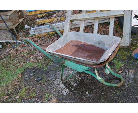 A wheelbarrow with spare hopper (no wheel and tyre).