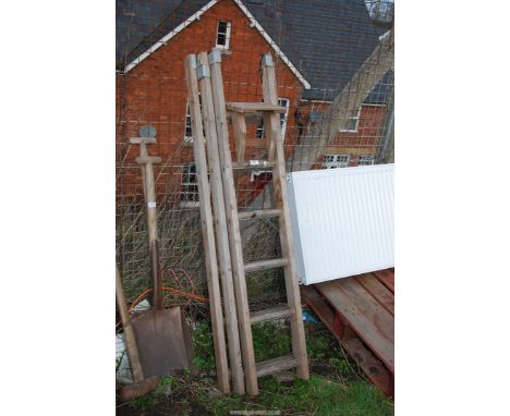 A wooden decorator's ladder.