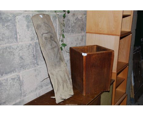 A wooden planter and wood carving.