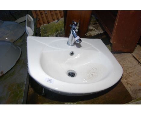 Small hand basin and tap.