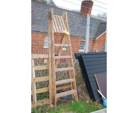 A six rung wooden step ladder.