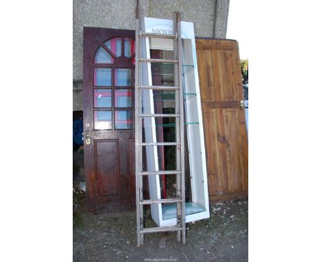 An eight-rung Aluminum extending Ladder.