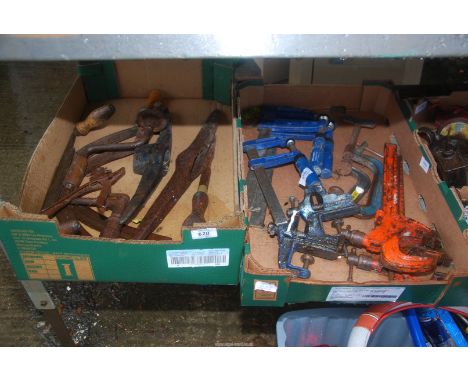 A box of brass hooks, pick axe, vice and clamp etc.