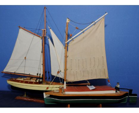 Scale model of a single masted yacht and another of a single masted trade boat (2)