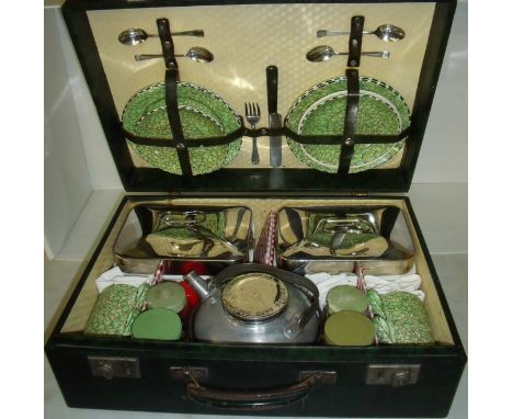 Cased picnic set containing Burslem cups, saucers and plates with two ceramic and stainless steel lidded dishes, teapot, cond