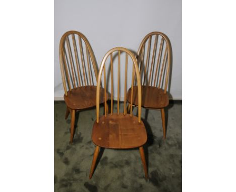 Set of three Ercol style elm hoop back stick back dining chairs 