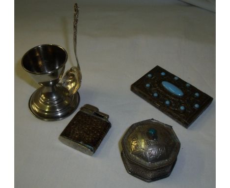 Selection of silver plate including egg cup with integral spoon holder, snake skin covered lighter, white metal Indian style 