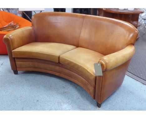 SOFA, curved form in tanned leather, 150cm W.