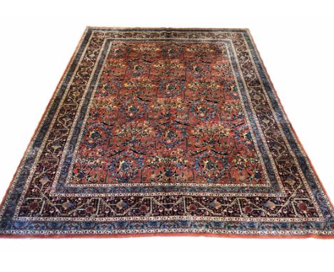 FINE ANTIQUE PERSIAN SAROUK CARPET, 367cm x 267cm, all over design on a terracotta field within multiple corresponding border