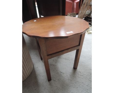 A vintage oak sewing table