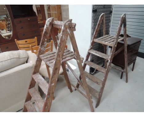 Two sets of vintage step ladders