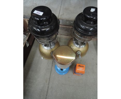 Two paraffin camping lamps, spare gas mantle and a smaller gas lamp