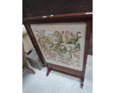 An early 20th century embroidered firescreen 