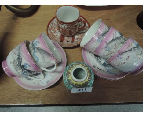 A Chinese style tea service with Geisha relief in base of cup