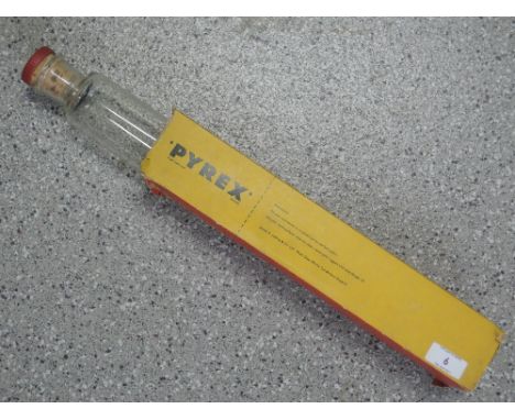 A Pyrex glass rolling pin in original package