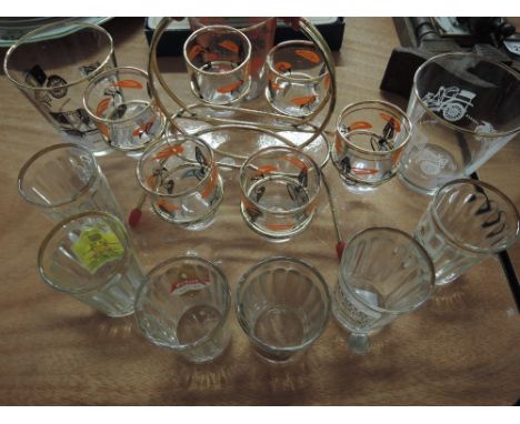 A selection of vintage retro shot glasses in stand etc
