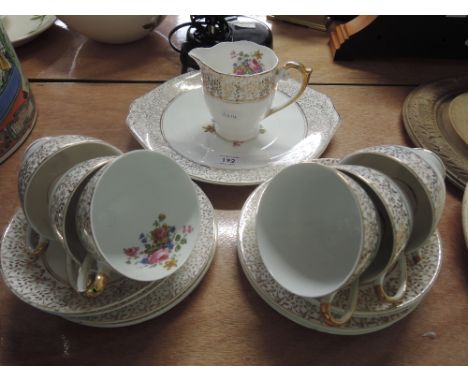 A Queen Ann part tea service with gilt and floral design (20 pieces approx)