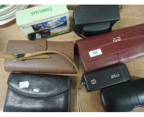 A selection of purses, a Kodak Instamatic camera and a panoramic camera etc