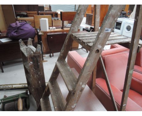 Two sets of vintage step ladders