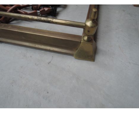 An adjustable brass fire fender