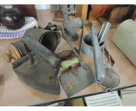 A selection of vintage kitchenalia including an IDA grater, Harper mincer and flat iron etc
