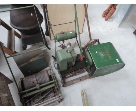 A vintage Atco petrol lawnmower, aerator and a pushmower