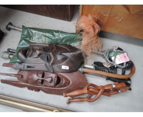 A selection of miscellaneous, walking poles, tribal art  masks etc