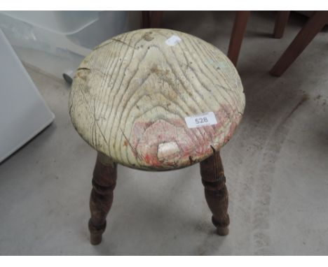 A vintage milking type stool