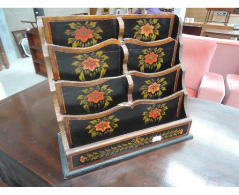 A vintage letter rack having painted foliate decoration