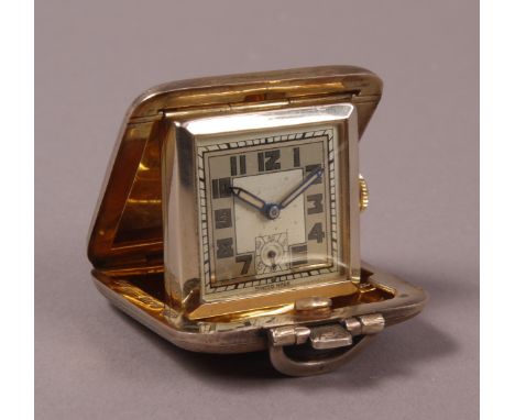 AN ART DECO FOLDING WATCH BY SAPHO in a silver gilt case, c.1936, the square two-tone gilt dial with cubist Arabic numerals, 