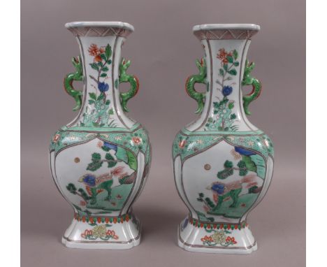 A PAIR OF SAMSON KANGXI STYLE FAMILLE VERTE VASES of shaped squared form with flared necks, decorated with Buddhist Lions, fl