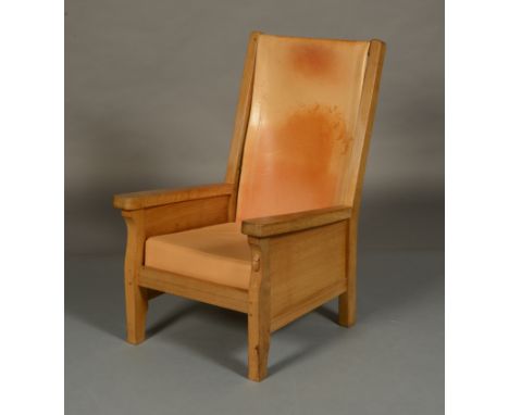 THOMPSON OF KILBURN 'MOUSEMAN'.  An oak armchair, having panelled sides and tan hide back and seat, on square legs, carved in