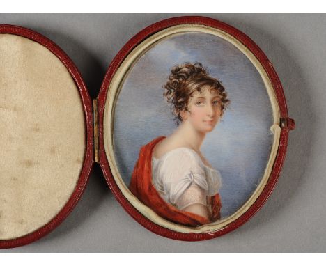 AN EARLY 19TH CENTURY OVAL PORTRAIT MINIATURE ON IVORY, depicting a shoulder length portrait of a young woman wearing classic