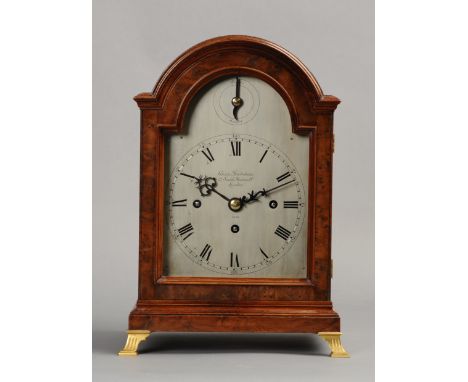 A YEW WOOD CASED MANTEL OR TABLE CLOCK BY CHARLES FRODSHAM, LONDON circa 1920, numbered 2478, the arched silvered dial with s