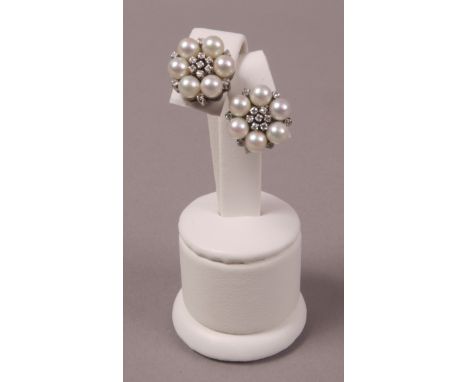 A PAIR OF CULTURED PEARL AND DIAMOND CLUSTER EAR STUDS, each set to the centre with eight-cut diamonds within a surround of 4