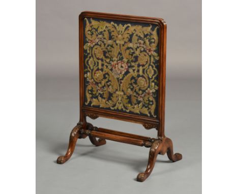 AN 18TH CENTURY STYLE WALNUT FIRESCREEN having a moulded frame, inset tapestry, on acanthus carved cabriole legs, joined by t