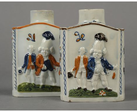 A PRATTWARE TEA CADDY, c.1800, moulded in relief with 'Macaroni' figures of a gentleman with exaggerated wig, his servant sta