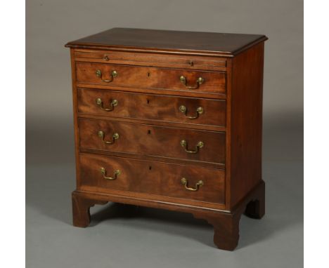 A GEORGE III GENTLEMAN'S MAHOGANY CHEST with brushing slide, over four graduated and cockbeaded drawers, with brass swing han