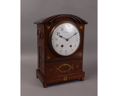 AN EDWARD VII BRASS INLAID CHIMING MANTEL CLOCK, in Regency style, retailed by Manoah Rhodes Ltd, Bradford, with white painte
