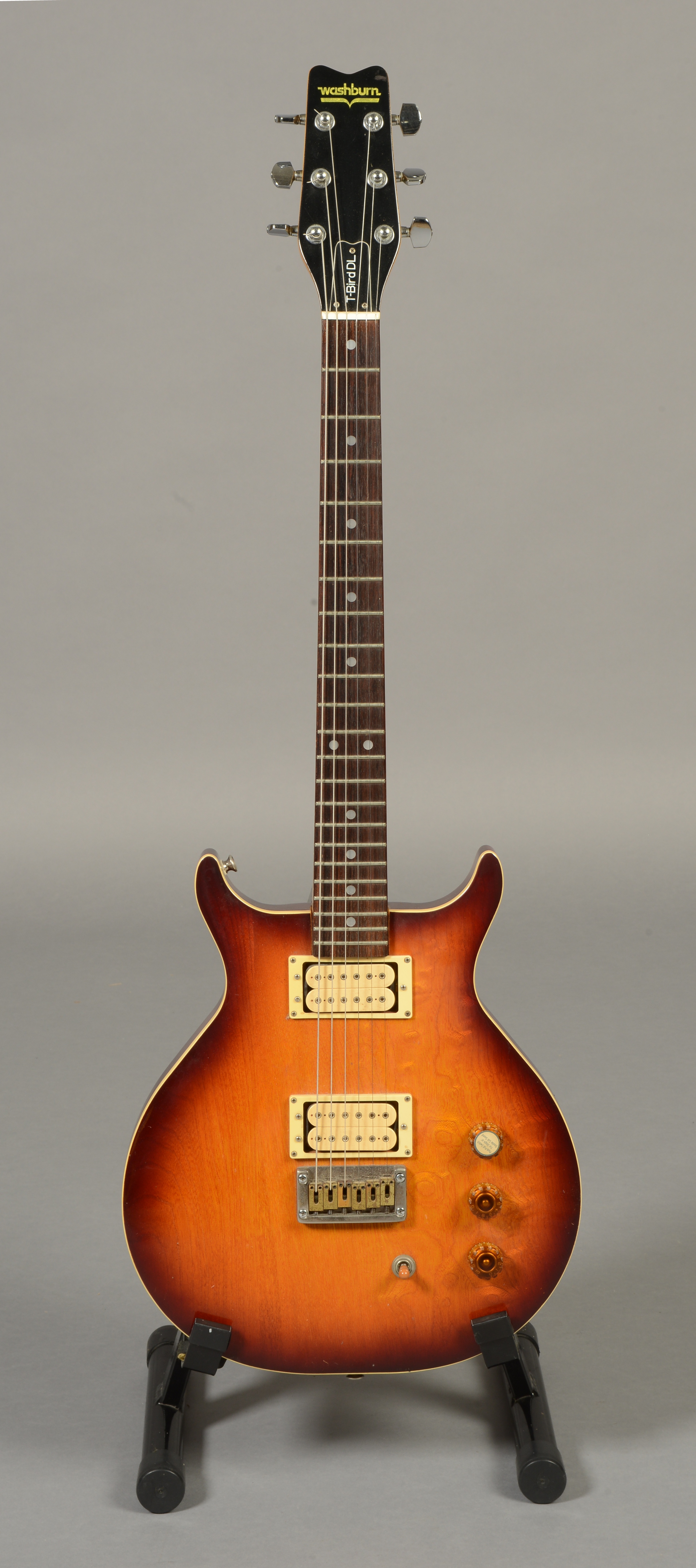 A WASHBURN TBIRD DL ELECTRIC GUITAR with mahogany double cutaway body