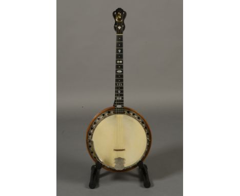 A WINDSOR SUPREMUS 'THE WHIRLE' TENOR FOUR STRING BANJO, with laminated walnut neck, inlaid ebony fretboard, chromed resonato
