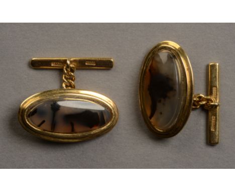 A PAIR OF CUFFLINKS by Storch, each collet set with an oval stepped cabochon of dendritic agate, raised against an oval surro