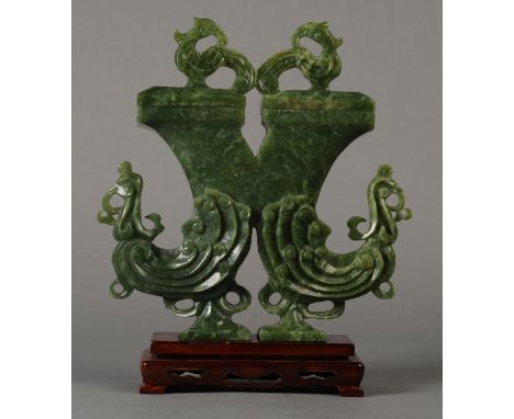 A 20TH CENTURY CHINESE SPINACH GREEN JADE TWIN PEACOCK VASE AND COVER with double bird finial, conjoined top, carved stylised