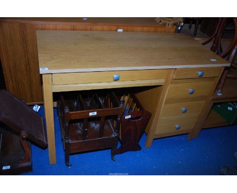 A light oak office desk, 47 1/2'' x 22 1/2'' x 29 /2'' high.