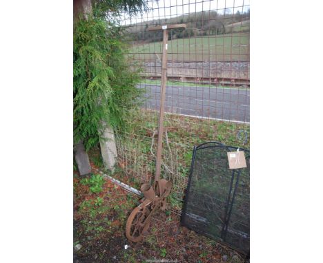 A vintage seed planter.
