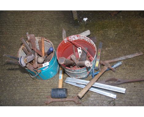 Two buckets of tools, mallet, hammers, stone mason's hammers, tin snips, etc.