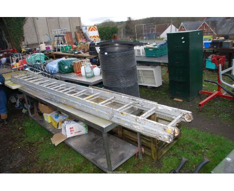 A fourteen rung aluminium extending ladder.
