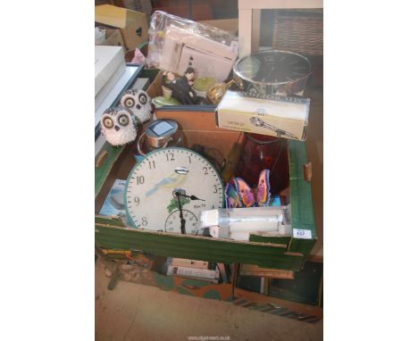 Two boxes of household items including storage jars, clocks, coasters, outdoor lighting, etc.